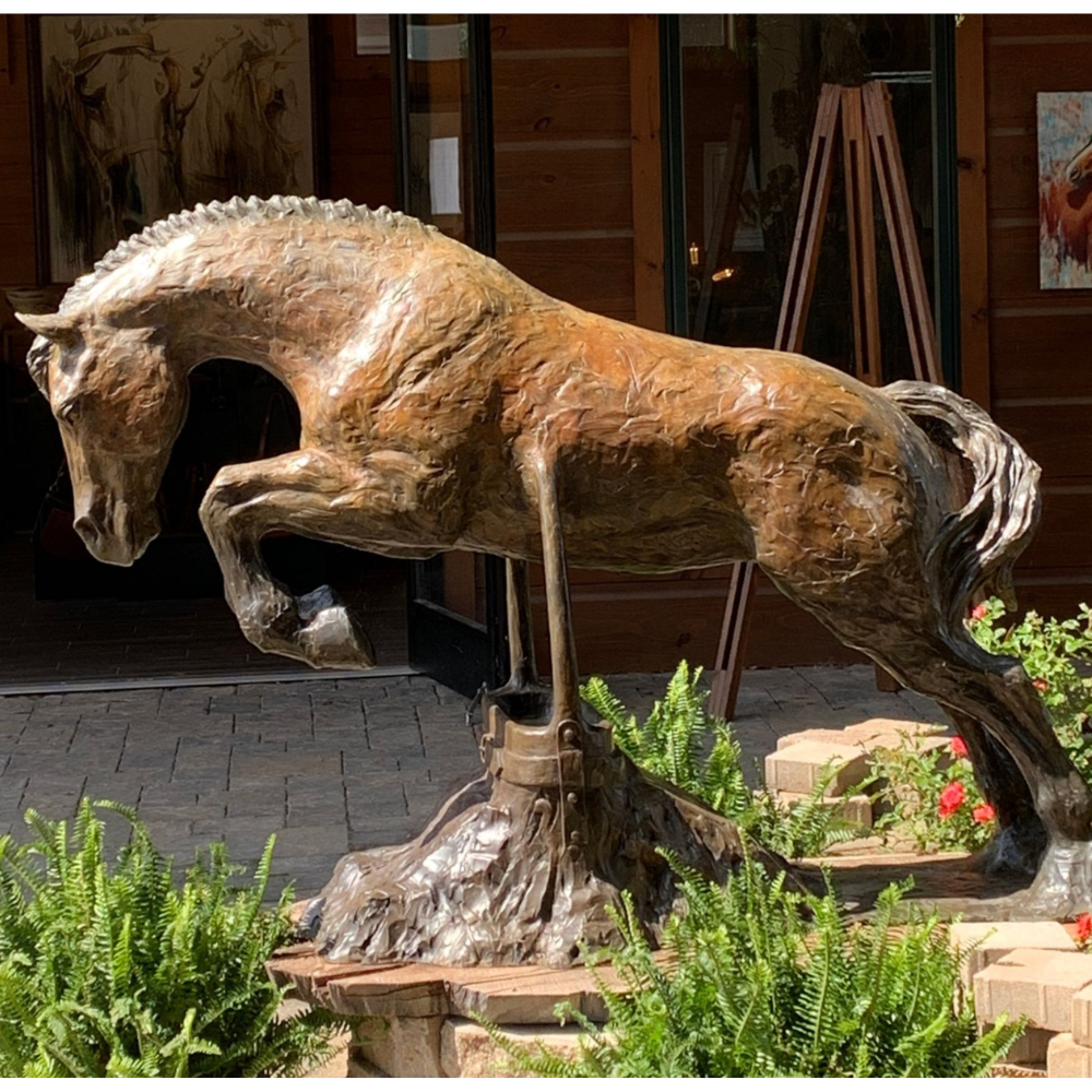 Heels Down Bronze jumping horse sculpture by Tammy Tappan standing 48" tall